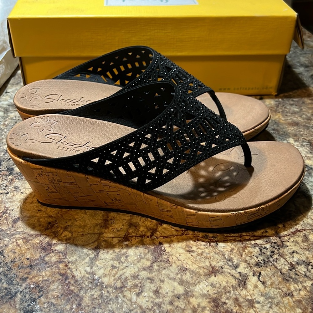 Black, scrappy, wedge sandals by sketchers